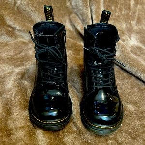 Used Dr. Martens, size 12 girls. Black, patent leather